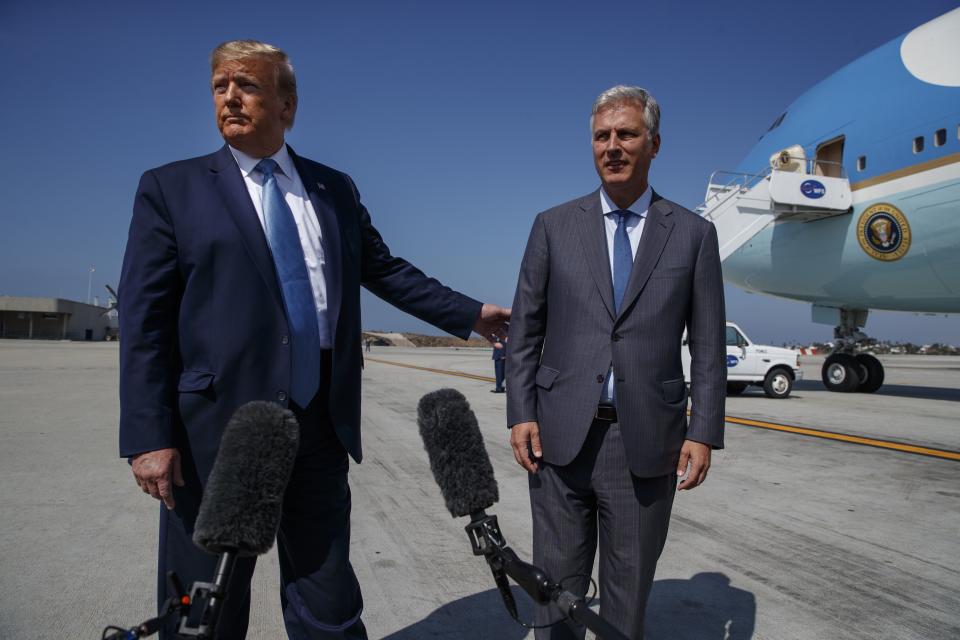 In this Sept. 18, 2019, file photo, U.S. President Donald Trump and new national security adviser Robert C. O’Brien talk with reporters before boarding Air Force One in Los Angeles. U.S. national security adviser O’Brien and Commerce Secretary Wilbur Ross will represent President Donald Trump at two regional summits in Thailand this weekend, the White House announced, a move that would widely be viewed in the region as a snub. | Evan Vucci, Associated Press