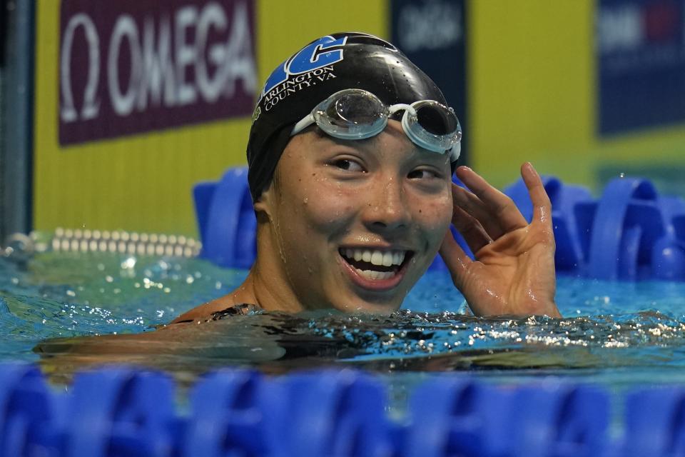 Torri Huske reacts after winning the Women's 100 Butterfly during wave 2 of the U.S. Olympic Swim Trials on Monday, June 14, 2021, in Omaha, Neb. (AP Photo/Jeff Roberson)