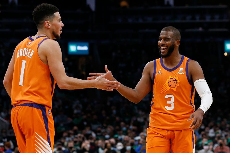Chris Paul (3), Devin Booker (1) and the Suns coasted through the season to the NBA's best record.