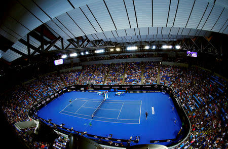 FILE PHOTO: France's Jo-Wilfried Tsonga serves during his third round match against compatriot Pierre-Hugues Herbert, with the roof closed at Margaret Court Arena, at the Australian Open tennis tournament at Melbourne Park, Australia, January 22, 2016. REUTERS/Jason O'Brien/File Photo