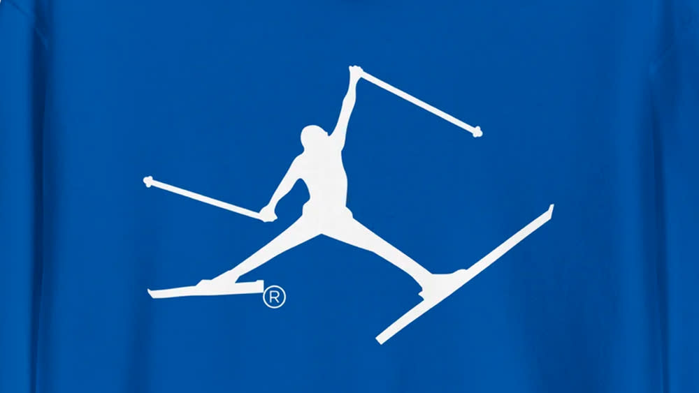  Skiman logo on a hoody, a logo that looks similar to the Nike Jordan logo but on skies. 