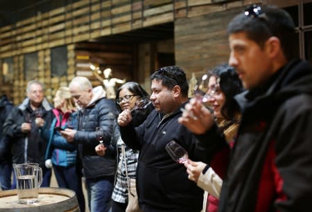 Visitors participate in a wine tasting at the Santa Julia winery of Familia Zuccardi, in Mendoza Province