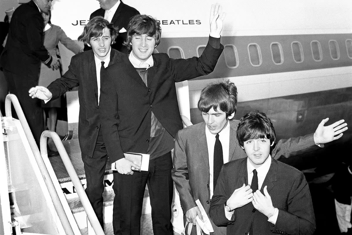 We have lift-off: (from left) Ringo Starr, John Lennon, George Harrison and Paul McCartney board their plane at Heathrow airport for their tour of America in 1964 (PA)