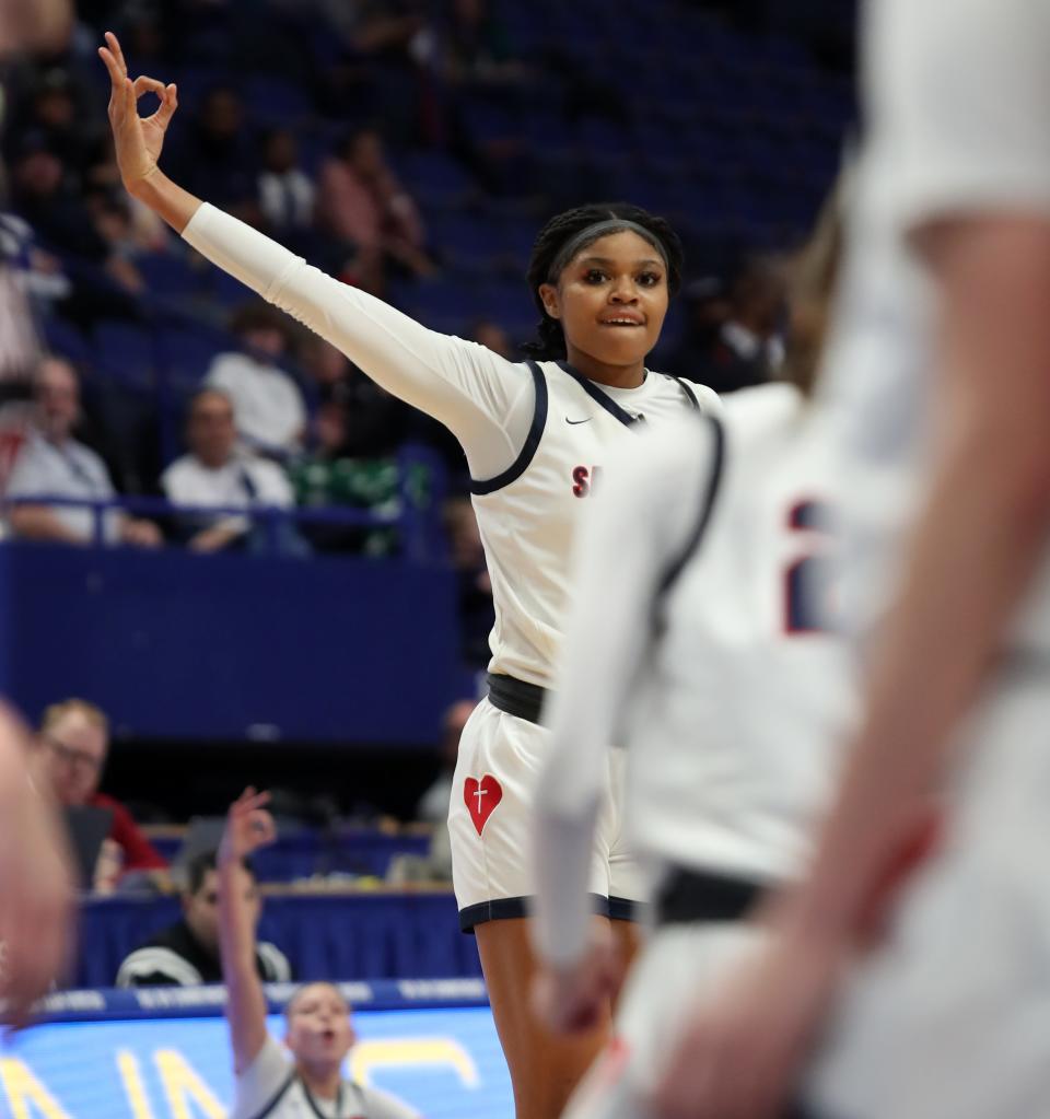 Sacred Heart’s ZaKiyah Johnson celebrates making a three against McCracken in the 2023 Mingua Beef Jerky Girls Sweet 16 on March 11, 2023.