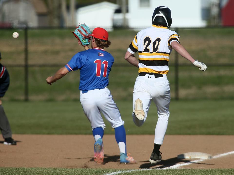 Licking Valley pitcher Evan Lichtenauer takes a throw from his first baseman to barely beat Watkins Memorial's Cole Massie for the out on Monday.