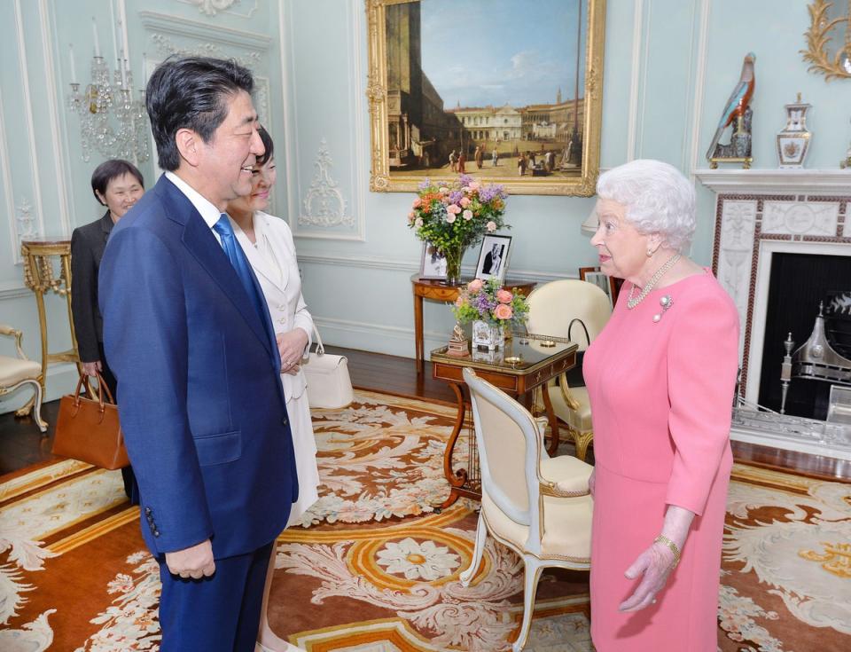 Queen Elizabeth II with former Prime Minister of Japan Shinzo Abe (PA) (PA Archive)