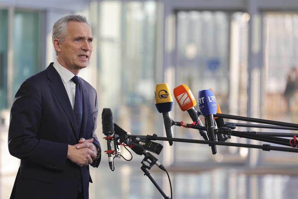 NATO Secretary General Jens Stoltenberg speaks as he arrives for a NATO defense ministers meeting at NATO headquarters in Brussels, Tuesday, Feb. 14, 2023. (AP Photo/Olivier Matthys)