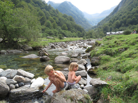 The simple joys of camping: Hattie Garlick's children play in a river - Credit: Hattie Garlick