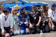 May 29, 2016; Indianapolis, IN, USA; IndyCar Series driver Alexander Rossi (98) prepares to kiss the yard of bricks after winning the 100th running of the Indianapolis 500 at Indianapolis Motor Speedway. Mandatory Credit: Michael Madrid-USA TODAY Sports