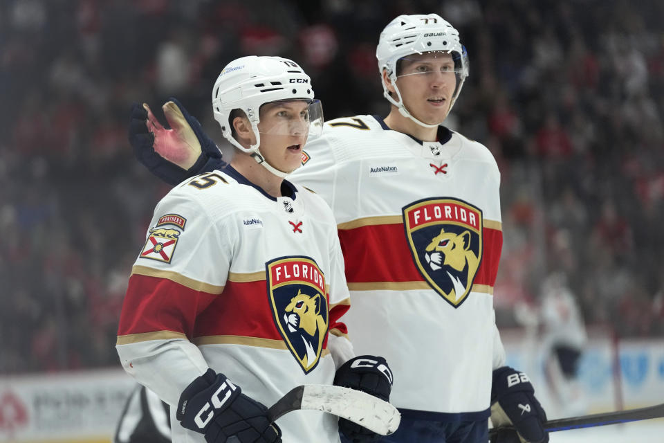 Florida Panthers center Anton Lundell, left, celebrates his goal with Niko Mikkola against the Detroit Red Wings in the third period of an NHL hockey game Thursday, Nov. 2, 2023, in Detroit. (AP Photo/Paul Sancya)