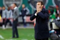 Nov 8, 2014; Washington, DC, USA; D.C. United head coach Ben Olsen reacts on the sidelines against the New York Red Bulls in the second half of leg 2 of the Eastern Conference semifinals in the 2014 MLS Cup Playoffs at Robert F. Kennedy Memorial. United won the leg 2-1, and the Red Bulls advanced 3-2 on aggregate. Mandatory Credit: Geoff Burke-USA TODAY Sports
