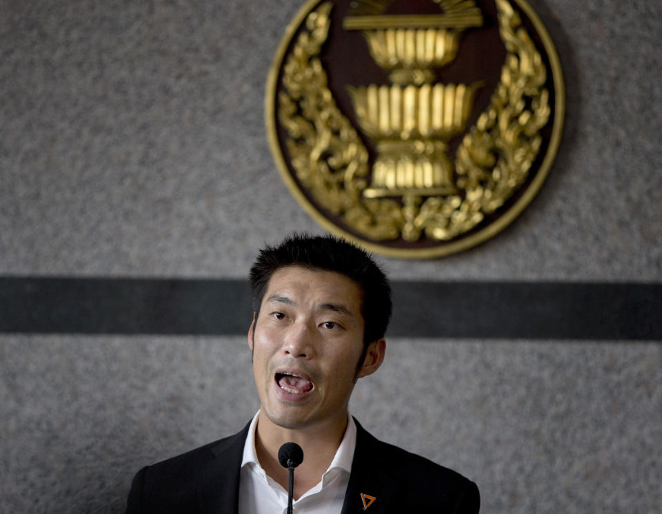 FILE - In this June 5, 2019, file photo, Thanathorn Juangroongruangkit, leader of the anti-military Future Forward Party, speaks to journalists in Bangkok, Thailand. The Constitutional Court said Wednesday, June 26, 2019, it will allow 32 pro-military lawmakers to keep their seats while it decides whether they violated election rules by holding shares in media companies, a decision criticized as unfair because the court earlier suspended an opposition leader over a similar allegation. (AP Photo/Gemunu Amarasinghe, File)