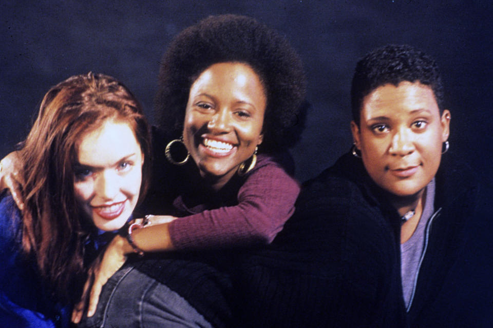 Three smiling women, including Lisa Marie Bronson