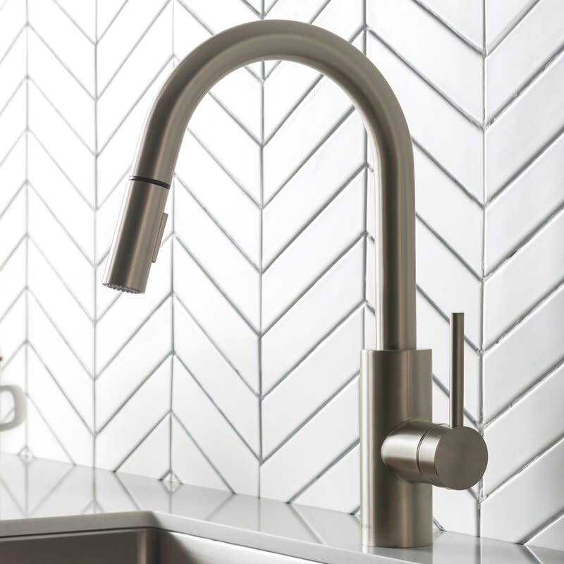 Oletto Pull Down Single Handle Kitchen Faucet with Side Spray. Image via Wayfair.