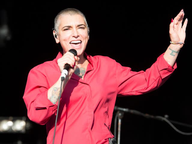 <p>Rob Ball/Redferns/Getty</p> Sinéad O'Connor performs on stage at Camp Bestival at Lulworth Castle on Aug. 3, 2014