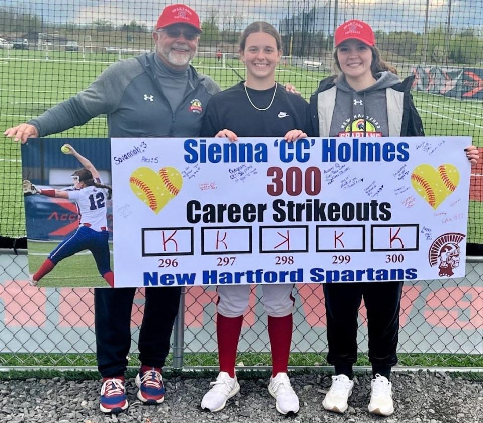 New Hartford senior Sienna Holmes (center) recorded her 300th career strikeout against Rome Free Academy Tuesday at the Accelerate Sports Complex. Holmes shut out the Black Knights, earning her seventh win of the season and extending the Spartans' win streak to five games.