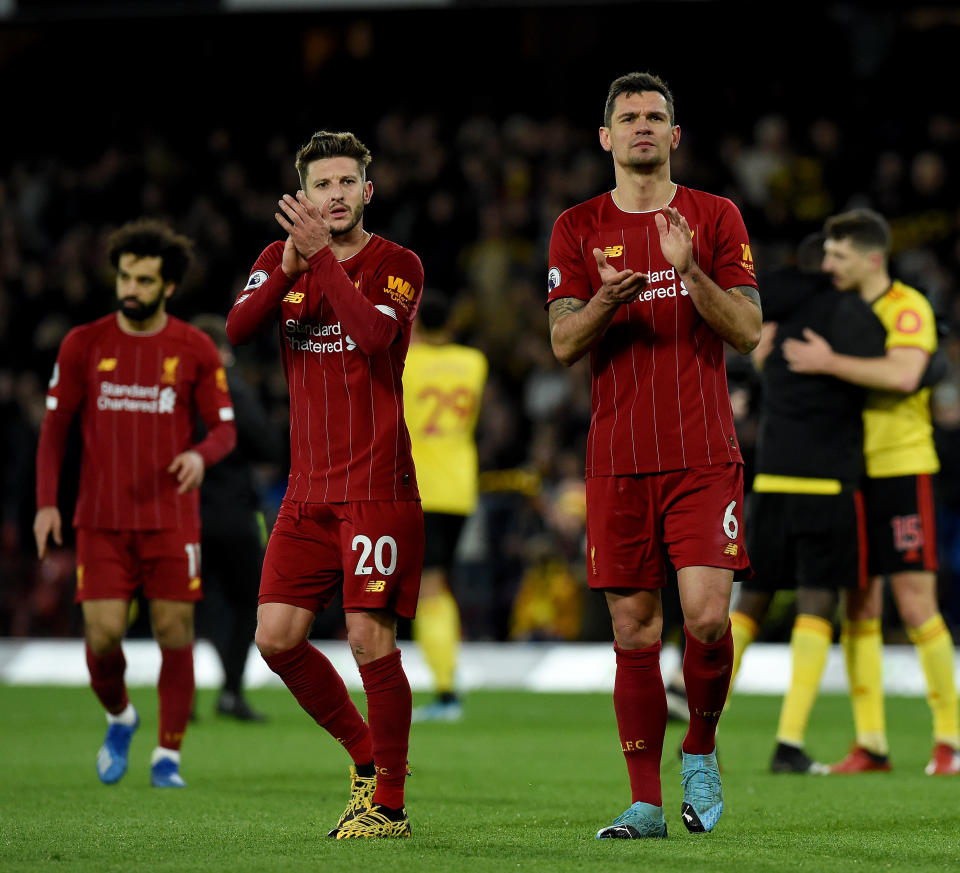WATFORD, ENGLAND - FEBRUARY 29: (THE SUN OUT, THE SUN ON SUNDAY OUT) Dejan Lovren and Adam Lallana of Liverpool showing their appreciation to the fans at the end of the Premier League match between Watford FC and Liverpool FC at Vicarage Road on February 29, 2020 in Watford, United Kingdom. (Photo by John Powell/Liverpool FC via Getty Images)