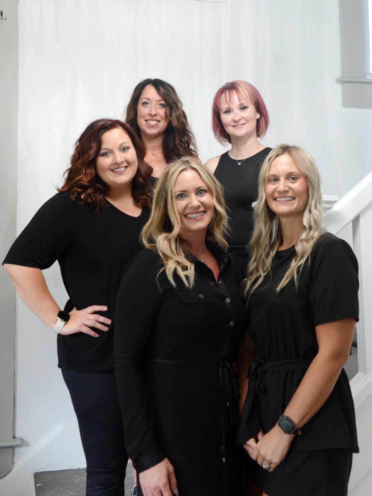 Owner Teisha Lewellen, middle, joined forces with Heather Jadwin, left, Nikole Daniels, Bethany Shawger and Nicole Armstrong to form The Design Studio Salon and Spa on Adair Avenue in Zanesville. It offers a full-service salon and spa in a private atmosphere in a historic building that was fully renovated and preserved.