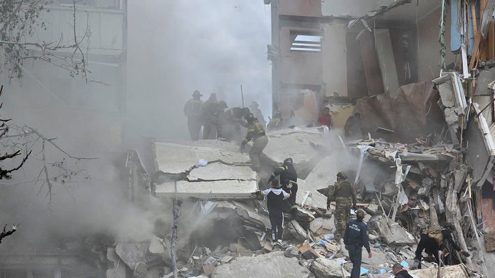 Firemen search rubble