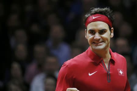 Switzerland's Roger Federer reacts during their Davis Cup final singles tennis match against France's Richard Gasquet at the Pierre-Mauroy stadium in Villeneuve d'Ascq, near Lille, November 23, 2014. REUTERS/Gonzalo Fuentes