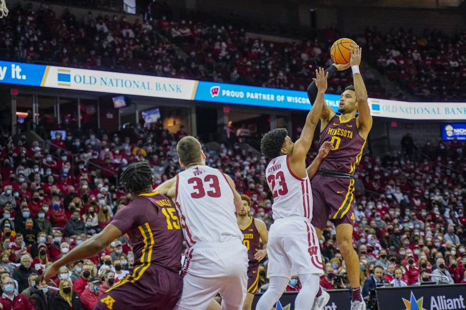 Minnesota's Payton Willis (0) shoots against Wisconsin's Chucky Hepburn (23) during the first half of an NCAA college basketball game Sunday, Jan. 30, 2022, in Madison, Wis. (AP Photo/Andy Manis)
