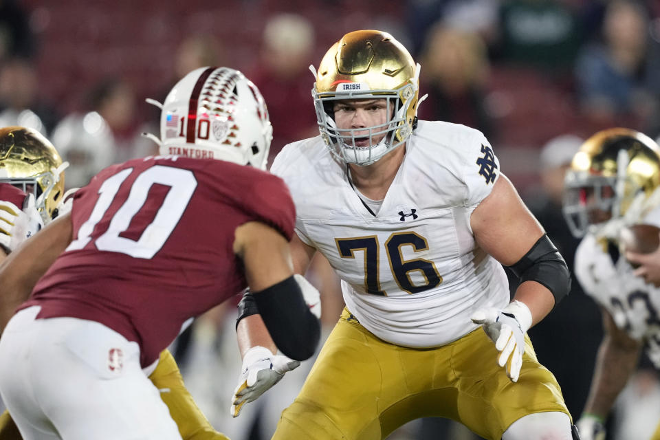 Nov 27, 2021; Stanford, California, USA; Notre Dame Fighting Irish offensive lineman Joe Alt (76) blocks Stanford Cardinal linebacker Jordan Fox (10) during the fourth quarter at Stanford Stadium. Mandatory Credit: Darren Yamashita-USA TODAY Sports