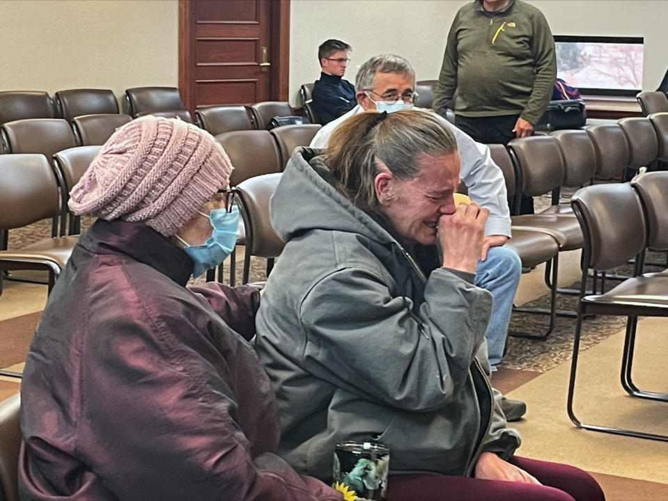 Jennifer Boever, whose husband was killed in 2020 by a car driven by South Dakota Attorney General Jason Ravnsborg, reacts Monday, March 28, 2022, in Pierre, S.D., as a House committee recommends no impeachment charges for Ravnsborg. (AP Photo/Stephen Groves)