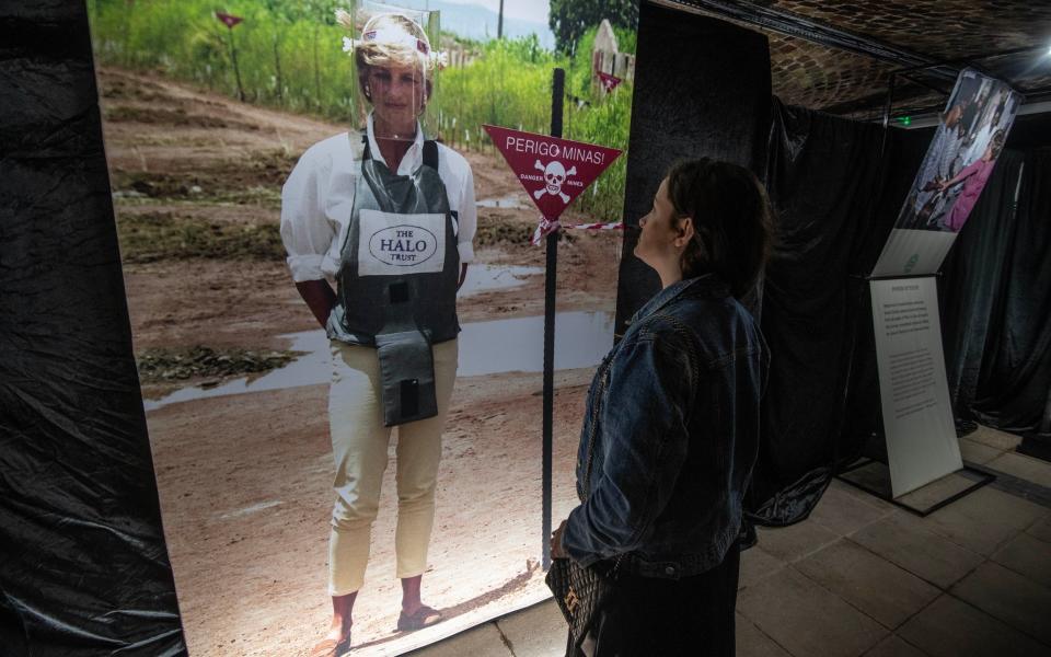 Diana striding through an Angolan land min