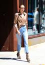 <p>I'm beginning to think that Gigi's closet is literally just a room full of mom jeans – and honestly I'm jealous af. She paired her faves with an androgynous button-up and the most badass booties you've ever seen. </p>