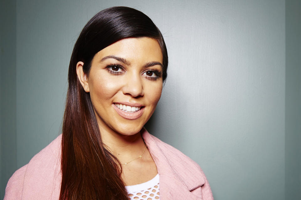 This March 24, 2014 photo shows TV personality and businesswoman Kourtney Kardashian while promoting the new Kardashian Kids clothing line in New York. (Photo by Dan Hallman/Invision/AP)