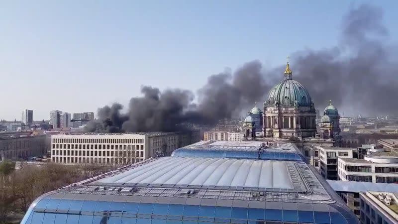 Smoke rises over the Berlin Palace (Stadtschloss) in Berlin