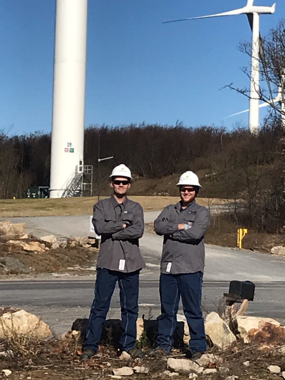 Andrew Cosner (left) and Tyler Simmons, two recent graduates of the Wind Energy Technology program at Eastern Community College & Technical Center, have been hired by Clearway Energy to work at their wind farms.