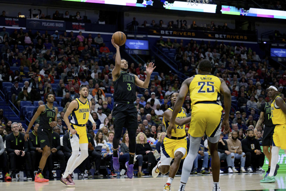 New Orleans Pelicans guard CJ McCollum (3) shoots against the Indiana Pacers during the first half of an NBA basketball game Friday, March 1, 2024, in New Orleans. (AP Photo/Matthew Hinton)