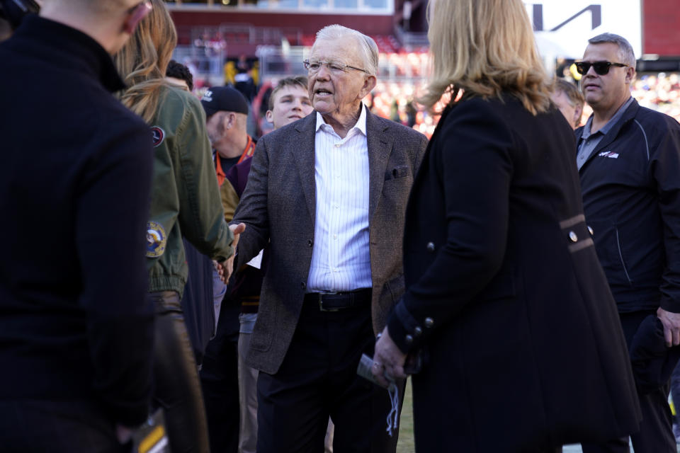 FILE - Former Washington Redskins head coach Joe Gibbs stands on the sidelines before an NFL football game between the Washington Commanders and Cleveland Browns, Sunday, Jan. 1, 2023, in Landover, Md. Joe Gibbs has sold a minority stake in his NASCAR team to prominent members of the group awaiting approval to take over ownership of the NFL’s Washington Commanders. The deal announced Tuesday, June 20, said Joe Gibbs Racing has “received a significant investment” from Harris Blitzer Sports & Entertainment for the minority stake in the team. T(AP Photo/Patrick Semansky, File)