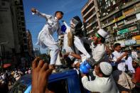 Muslims take part in a protest in Dhaka