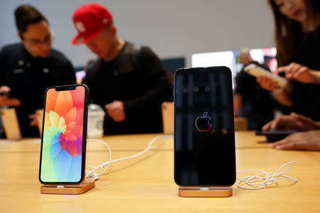 The new Apple iPhone Xs Max and iPhone X are seen on display at the Apple Store in Manhattan, New York, U.S., September 21, 2018. REUTERS/Shannon Stapleton