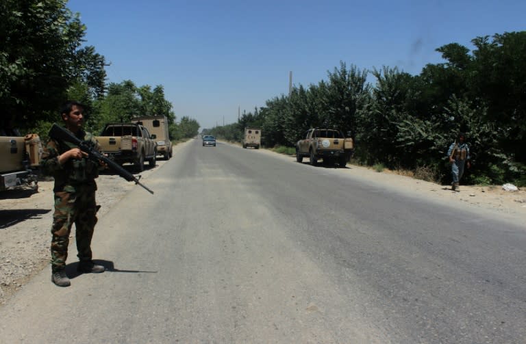 Afghan security personnel keep watch as they take part in an operation against Taliban militants at the Aliabad district of Kunduz province on May 31, 2016