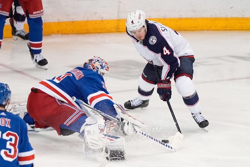 Columbus Blue Jackets' Cole Sillinger (4) shoots against New York Rangers goaltender Igor Shesterkin (31) during the third period of an NHL hockey game Wednesday, Feb. 28, 2024, in New York. (AP Photo/Frank Franklin II)