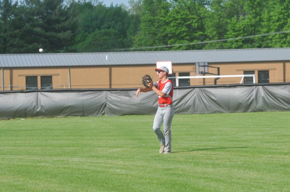 Buckeye Central's Heath Jensen throws the ball in after a fly ball.