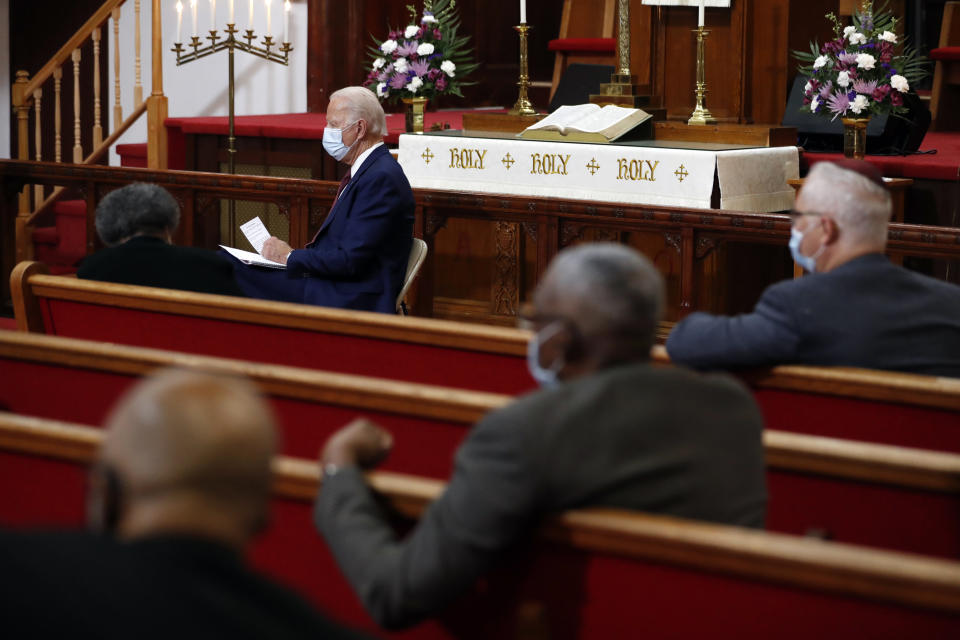 FILE - In this Monday, June 1, 2020, file photo, Democratic presidential candidate, former Vice President Joe Biden listens as clergy members and community activists speak during a visit to Bethel AME Church in Wilmington, Del. Democrats are betting on Biden’s evident comfort with faith as a powerful point of contrast in his battle against President Donald Trump. (AP Photo/Andrew Harnik, File)