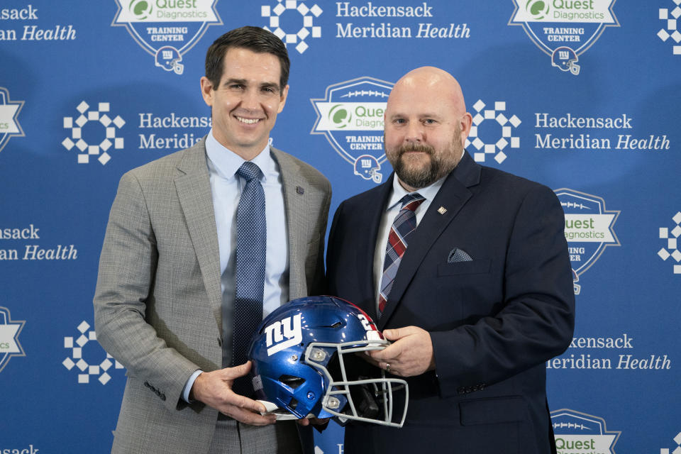 FILE - New York Giants general manager Joe Schoen, left, and Giants new head coach Brian Daboll, right, pose for a photograph during a news conference at the NFL football team's training facility, Monday, Jan. 31, 2022, in East Rutherford, N.J. Coming off five consecutive losing seasons, the Giants have gone to Buffalo to fix things. They hired former Bills assistant general manager Joe Schoen to run the front office and offensive coordinator Brian Daboll to lead the team. (AP Photo/John Minchillo, File)