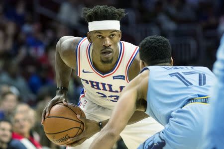 Dec 2, 2018; Philadelphia, PA, USA; Philadelphia 76ers guard Jimmy Butler (23) controls the ball against Memphis Grizzlies guard Garrett Temple (17) during the fourth quarter at Wells Fargo Center. Mandatory Credit: Bill Streicher-USA TODAY Sports