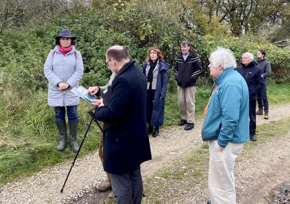 The Council Inspector (2nd from left) surveys the site, joined by Ros Emrys-Roberts, representing the Norfolk Ramblers (L) and Sine Garvie-McInally, the homeowner (3rd from left). (Eastern Daily Press / SWNS)