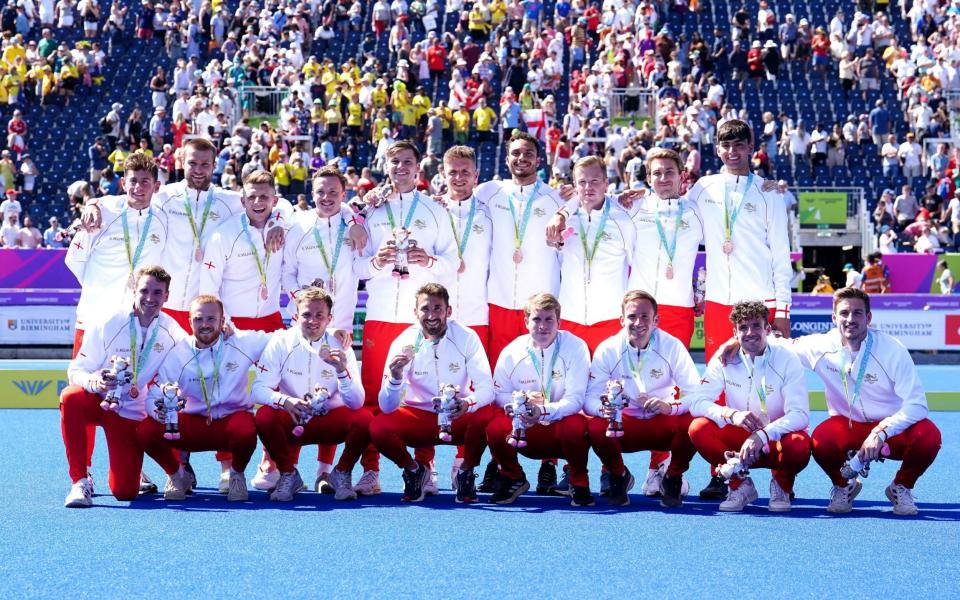 England men's hockey team celebrate with the bronze  - PA