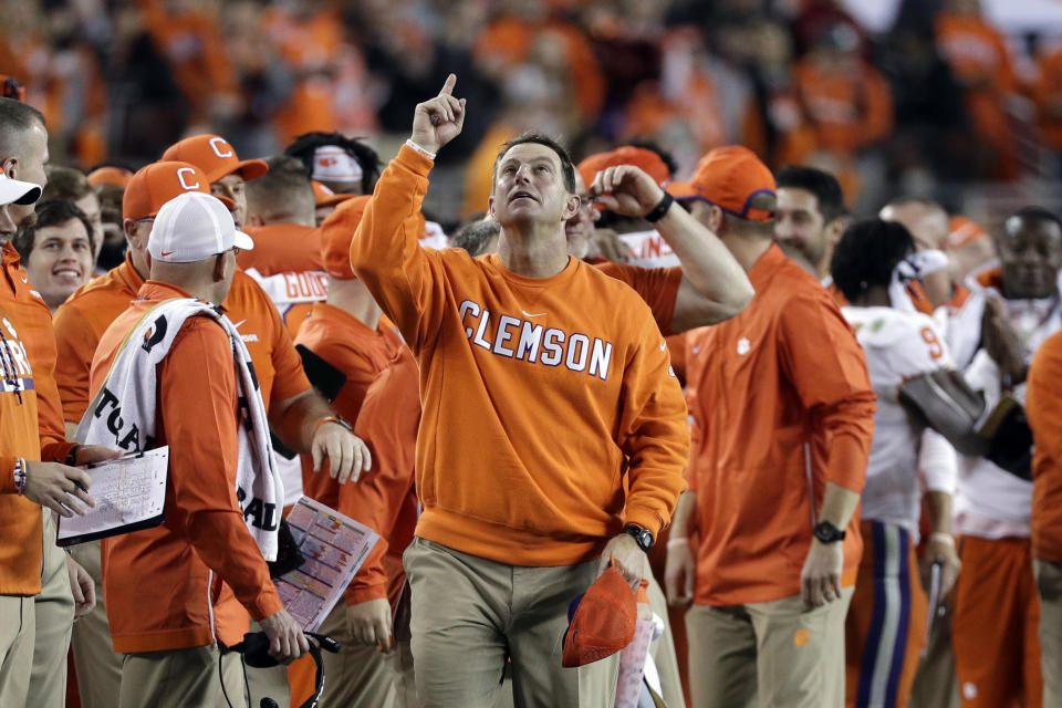 FILE - In this Jan. 7, 2019, file photo, Clemson head coach Dabo Swinney celebrates in the final seconds of the NCAA college football playoff championship game against Alabama, in Santa Clara, Calif. For the first time, the defending national champion Tigers are No. 1 in The Associated Press preseason Top 25 presented by Regions Bank, Monday, Aug. 19, 2019. (AP Photo/David J. Phillip, File)