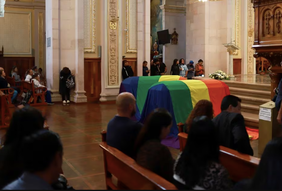 Coffins were draped with the LGBT flag at the funeral (REUTERS/Edgar Chavez)