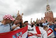 Soccer Football - World Cup - Semi-Final - Croatia v England - Moscow, Russia - July 10, 2018. Supporters pose for a picture as they gather in Red Square. REUTERS/Gleb Garanich