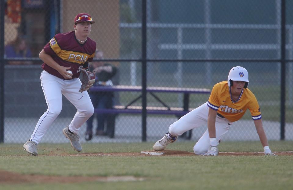 Nevada's Drake Hinson (7) slides safely into third base as PCM third baseman Carson Hansen (5) catches the late thrown ball during the first inning of the Cubs' 8-7 loss to the Mustangs at the Nevada Cubs Baseball Field on Friday, June 9, 2023, in Nevada, Iowa.