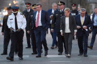 <p>Toronto Police Chief Mark Saunders, front left, Toronto Mayor John Tory, Premier Wynne and Ralph Goodale, Federal Minister of Public Safety and Emergency Preparedness walk together towards a news conference after viewing the scene where a rented van plowed down a crowded Toronto sidewalk on Monday, April 23, 2018. (Photo: Nathan Denette/The Canadian Press via AP) </p>