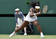 Serena Williams of the U.S.A. hits a shot during her match against Venus Williams of the U.S.A. at the Wimbledon Tennis Championships in London, July 6, 2015. REUTERS/Toby Melville